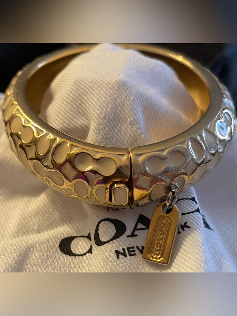 Coach Gold-Tone Embossed C Logo Hinged Bangle with Tag